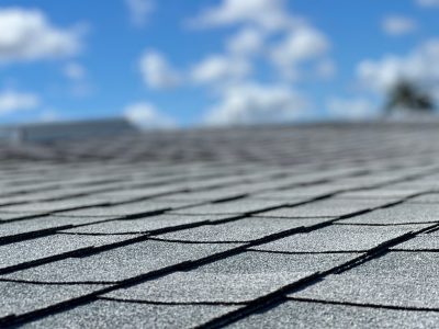 Shingle roof close up with depth of field on sunny Florida day with blue sky